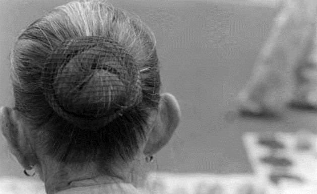 Grandma Hair Bun Secured With A Hairnet And Hairpin